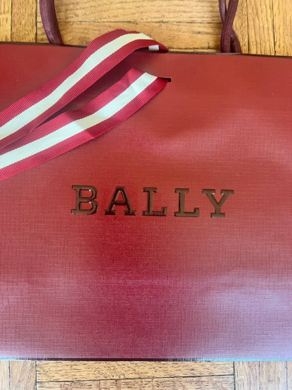 Bally burgundy paper shopping bag logo tote with striped ribbon strap